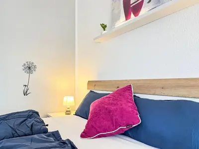 Ein Bett oder Betten in einem Zimmer der Unterkunft Apartment Flieder - A110 by Interhome