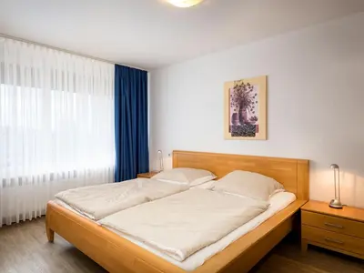 Ein Bett oder Betten in einem Zimmer der Unterkunft Apartment Rheinblick - A1208 by Interhome