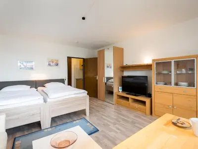 Ein Bett oder Betten in einem Zimmer der Unterkunft Apartment Fauna - B307 by Interhome