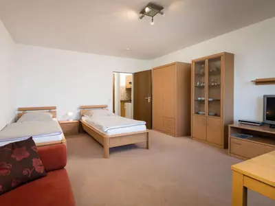 Ein Bett oder Betten in einem Zimmer der Unterkunft Apartment Baumblick - B610 by Interhome