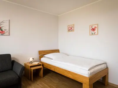 Ein Bett oder Betten in einem Zimmer der Unterkunft Apartment Butterblume - B808 by Interhome
