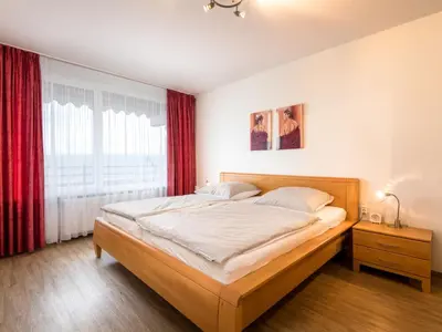 Ein Bett oder Betten in einem Zimmer der Unterkunft Apartment Luna - B901 by Interhome