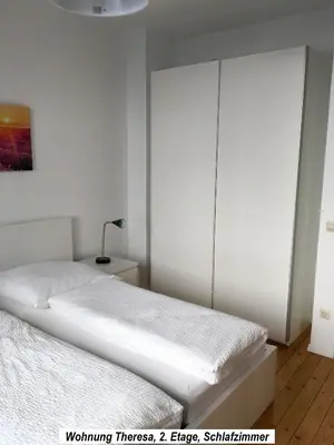 Ein Bett oder Betten in einem Zimmer der Unterkunft Ferienwohnung im Herzen der Koblenzer Altstadt
