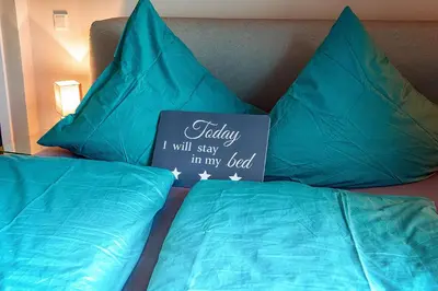 Ein Bett oder Betten in einem Zimmer der Unterkunft Holiday Trier City