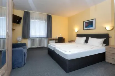 Ein Bett oder Betten in einem Zimmer der Unterkunft Hotel Westrich