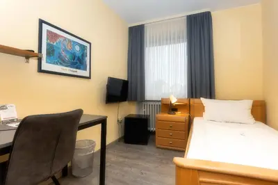 Ein Bett oder Betten in einem Zimmer der Unterkunft Hotel Westrich