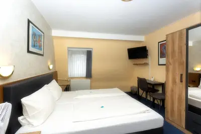 Ein Bett oder Betten in einem Zimmer der Unterkunft Hotel Westrich