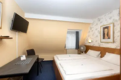 Ein Bett oder Betten in einem Zimmer der Unterkunft Hotel Westrich