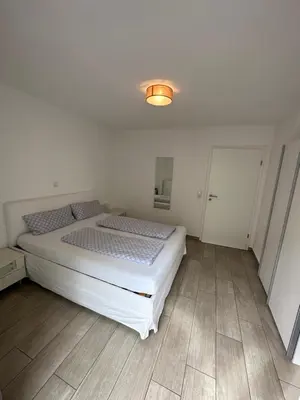 Ein Bett oder Betten in einem Zimmer der Unterkunft Apartments am Moselufer