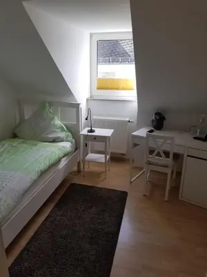Ein Bett oder Betten in einem Zimmer der Unterkunft Gästehaus Kloep