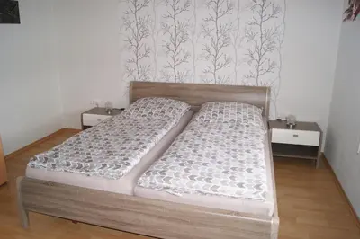 Ein Bett oder Betten in einem Zimmer der Unterkunft Haus Straus