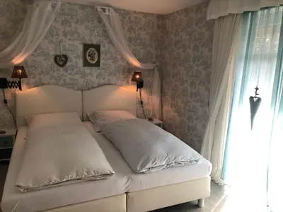 Ein Bett oder Betten in einem Zimmer der Unterkunft Romantikmühle Heartlandranch