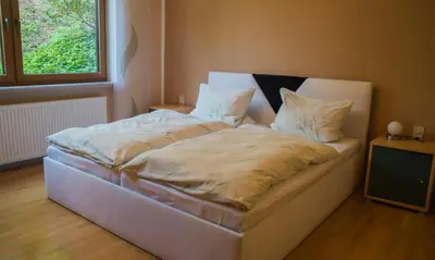 Ein Bett oder Betten in einem Zimmer der Unterkunft Zum Ehranger Wald 2a
