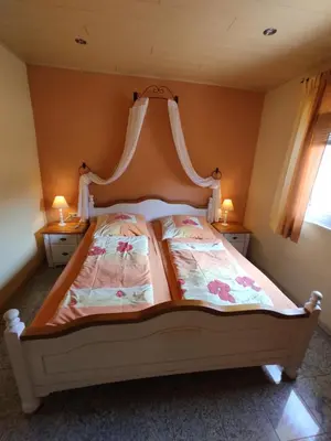 Ein Bett oder Betten in einem Zimmer der Unterkunft Moselferienweingut Schaefer