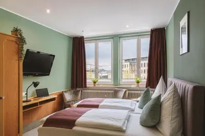 Ein Bett oder Betten in einem Zimmer der Unterkunft Hotel Louis Müller