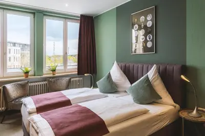 Ein Bett oder Betten in einem Zimmer der Unterkunft Hotel Louis Müller