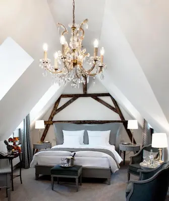 Ein Bett oder Betten in einem Zimmer der Unterkunft Romantik Hotel Zur Glocke