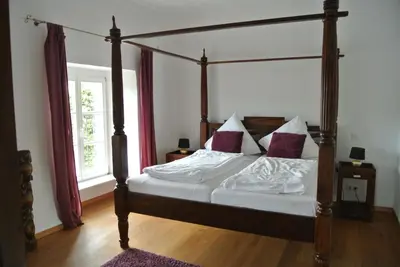 Ein Bett oder Betten in einem Zimmer der Unterkunft Gästehaus Sektstuuf St. Laurentius
