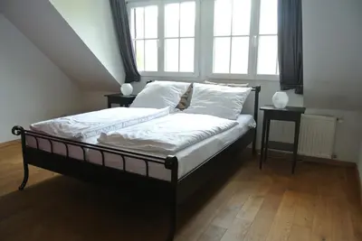 Ein Bett oder Betten in einem Zimmer der Unterkunft Gästehaus Sektstuuf St. Laurentius