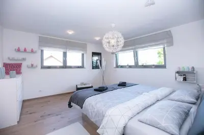 Ein Bett oder Betten in einem Zimmer der Unterkunft Fewo-LuxSus