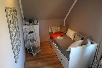 Ein Bett oder Betten in einem Zimmer der Unterkunft Ferienwohnung Maarland