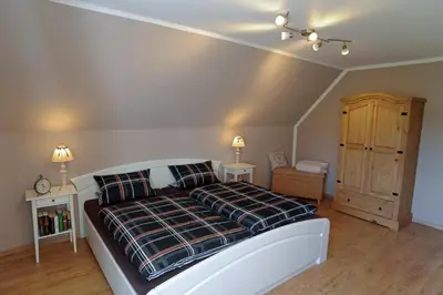 Ein Bett oder Betten in einem Zimmer der Unterkunft Ferienwohnung Maarland