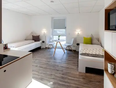 Ein Bett oder Betten in einem Zimmer der Unterkunft Boardinghouse Morbach