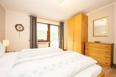 Ein Bett oder Betten in einem Zimmer der Unterkunft Ferien Weingut Pauly