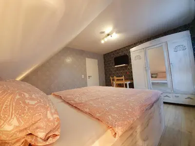Ein Bett oder Betten in einem Zimmer der Unterkunft Gästehaus Alte Giesserei