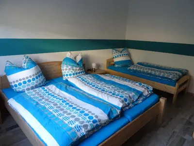 Ein Bett oder Betten in einem Zimmer der Unterkunft Haus Am Sonnenberg