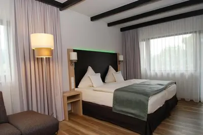 Ein Bett oder Betten in einem Zimmer der Unterkunft Hotel Steuer