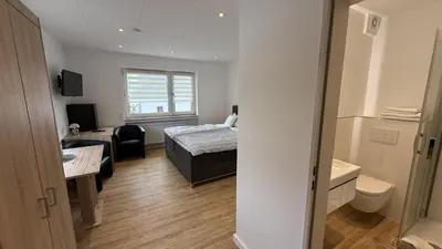 Ein Bett oder Betten in einem Zimmer der Unterkunft Gästehaus Fries