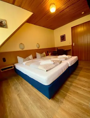 Ein Bett oder Betten in einem Zimmer der Unterkunft Pension Dören