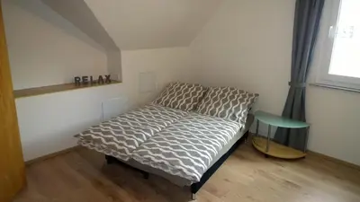 Ein Bett oder Betten in einem Zimmer der Unterkunft Ferienwohnung Kylltal
