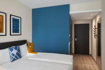 Ein Bett oder Betten in einem Zimmer der Unterkunft Four Points Flex by Sheraton Koblenz