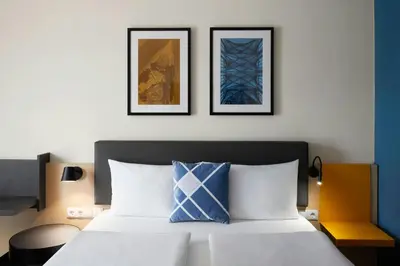 Ein Bett oder Betten in einem Zimmer der Unterkunft Four Points Flex by Sheraton Koblenz
