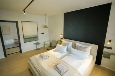 Ein Bett oder Betten in einem Zimmer der Unterkunft Hotel Weinhaus Kreuter