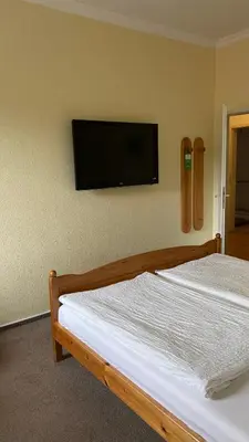 Ein Bett oder Betten in einem Zimmer der Unterkunft Panorama-Café MOSELGARTEN