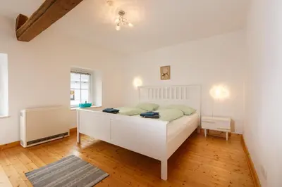 Ein Bett oder Betten in einem Zimmer der Unterkunft Auszeit-Eifel Eifelhaus 