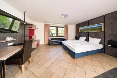Ein Bett oder Betten in einem Zimmer der Unterkunft Hotel Moselsteig