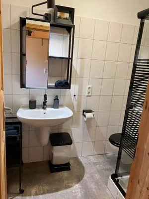 Ein Badezimmer in der Unterkunft Ferienwohnungen Park Café am Kurpark