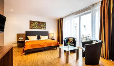 Ein Bett oder Betten in einem Zimmer der Unterkunft Schroeders Stadtwaldhotel