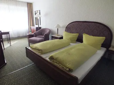 Ein Bett oder Betten in einem Zimmer der Unterkunft Hotel Moselkern