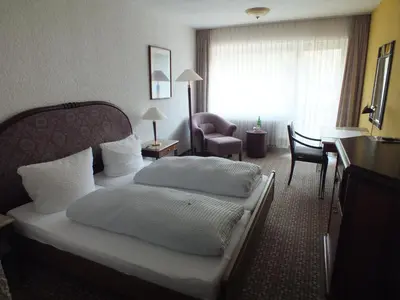 Ein Bett oder Betten in einem Zimmer der Unterkunft Hotel Moselkern