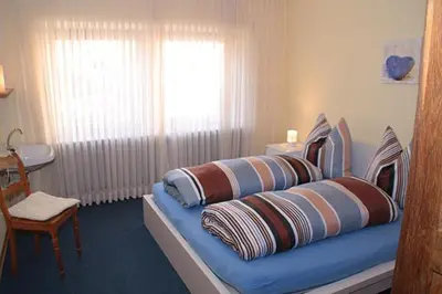 Ein Bett oder Betten in einem Zimmer der Unterkunft Ferienwohnung Helfenstein