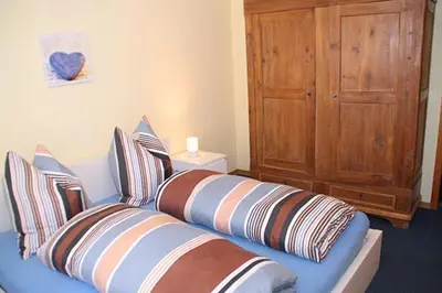 Ein Bett oder Betten in einem Zimmer der Unterkunft Ferienwohnung Helfenstein
