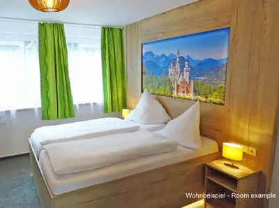 Ein Bett oder Betten in einem Zimmer der Unterkunft DORMERO Moselhotel Koblenz-Alken