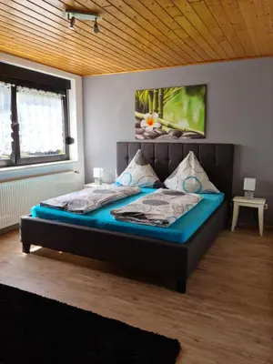 Ein Bett oder Betten in einem Zimmer der Unterkunft Gästehaus Portugall