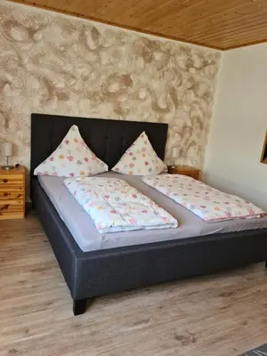 Ein Bett oder Betten in einem Zimmer der Unterkunft Gästehaus Portugall