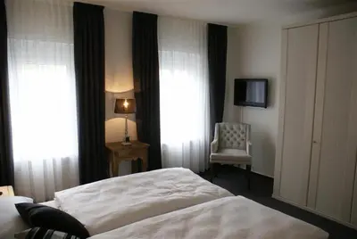 Ein Bett oder Betten in einem Zimmer der Unterkunft Hotel Stadt Coblenz
